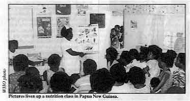 Pictures liven up a nutrition class in Papua New Guinea.
