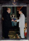 Dr. David Nalin receiving the Mahidol Medal from His Royal Highness the King of Thailand