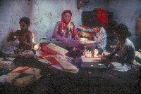 Woman and children making kites - A Kind of Living - slide 31