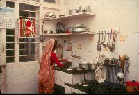 Woman at kitchen sink - A Kind of Living - slide 32