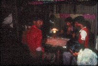 Youth playing carrom - A Kind of Living - slide 64