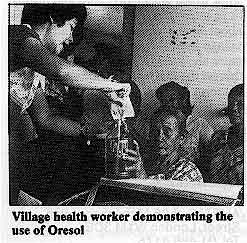 Village health worker demonstrating the use of Oresol 