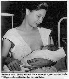 Breast is best - giving extra fluids is unnecessary - a mother in the Philippines breastfeeding her day-old baby. 